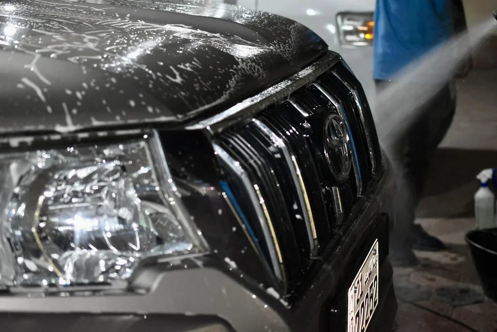 Paint protection wax coating applied to car body for long-lasting shine Kuwait - Posefore